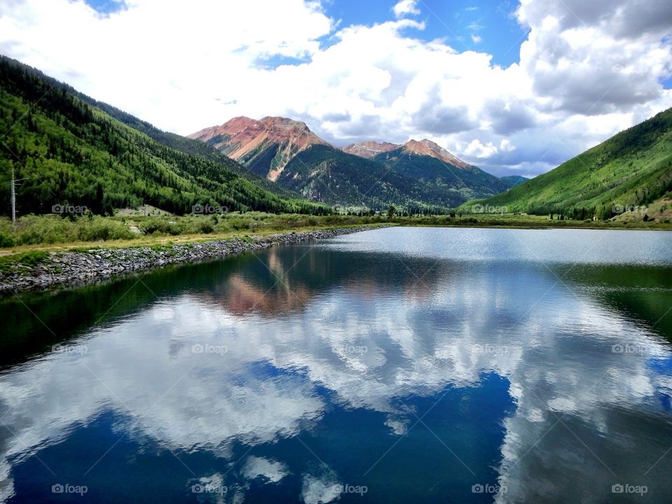 Clouds reflecting on river