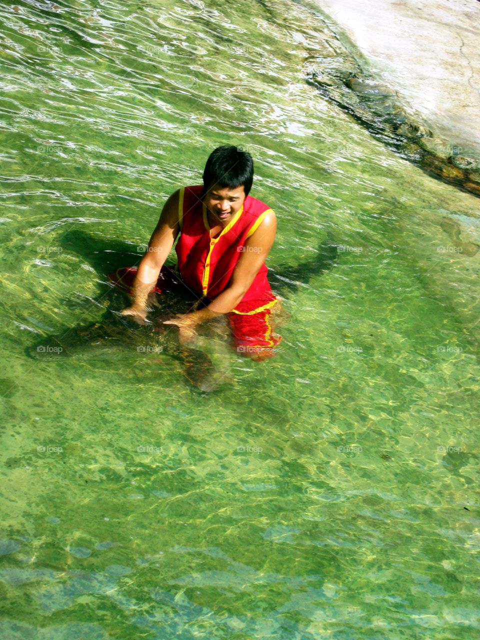 The man show catch the crocodile in the water