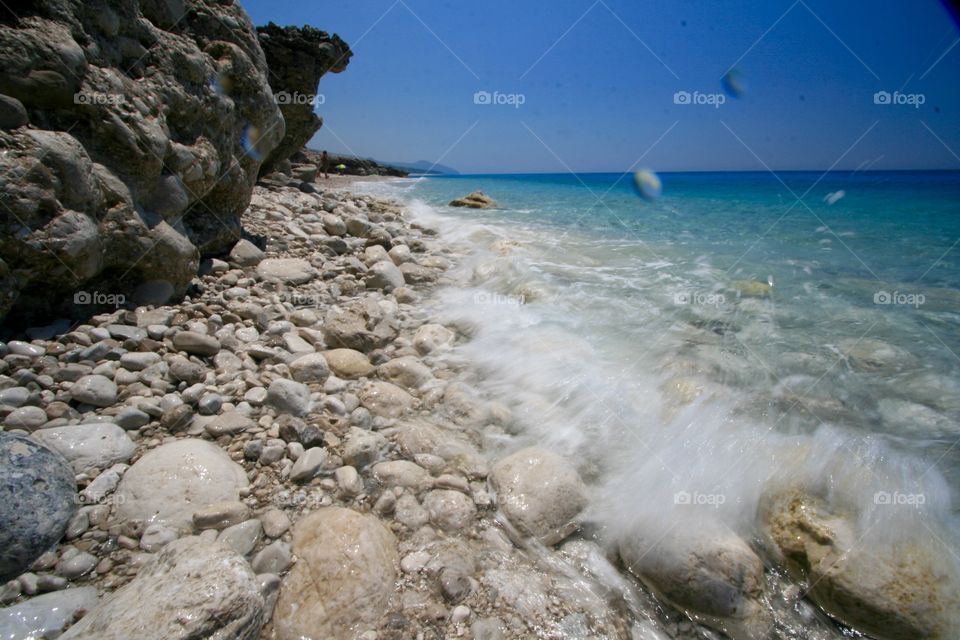 Scenic view of sea against blue sky