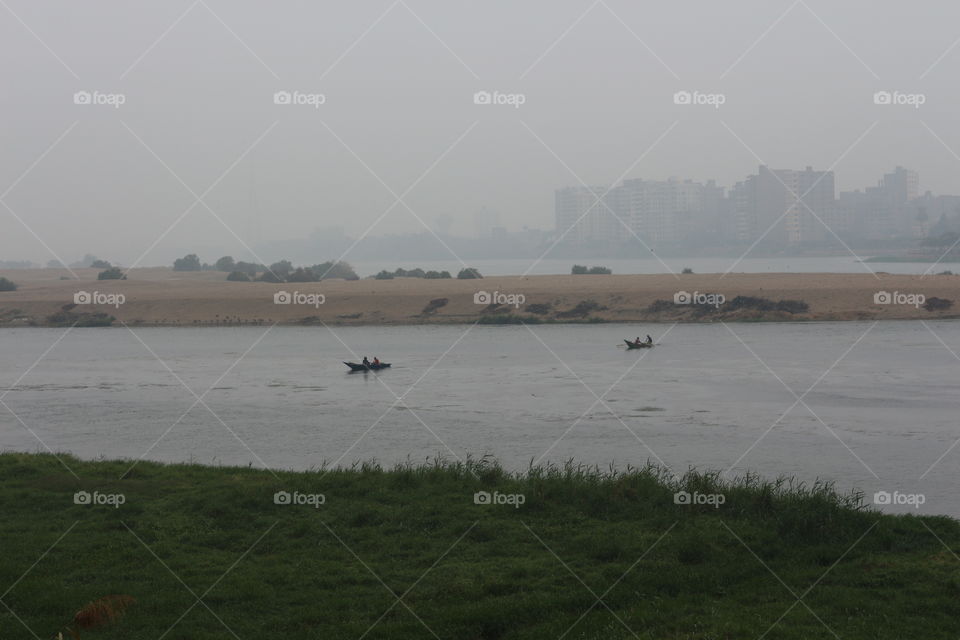 Nature - Islands - Sea - Nile River - Boats - Sky - Cloudy - Buildings - City