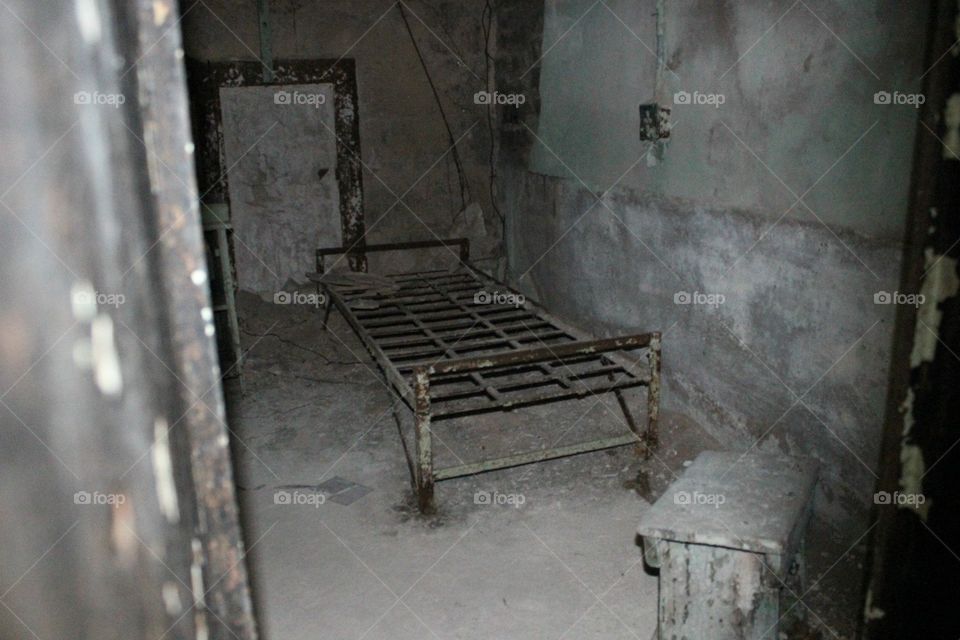 abandoned jail picture of bed frame