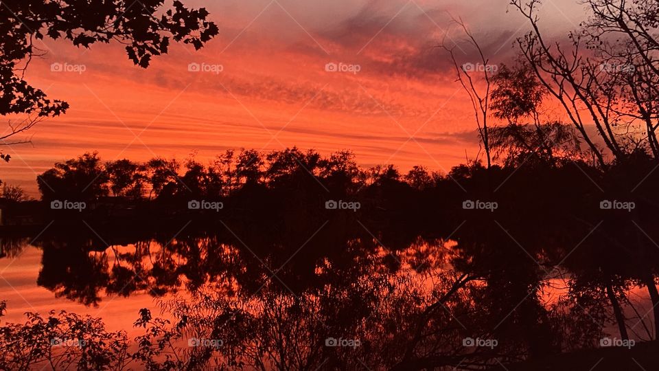 Fiery Red Evening Sky, Fiery Red glow on Lake Waters for Twilight edge of a Gorgeous Sunset To Twilight To Night