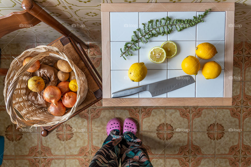 Direct above view of lemons and basket on a kitchen