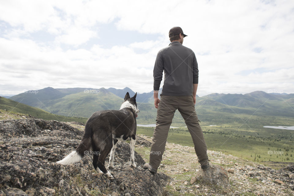 Dog and Guy on a Mountain