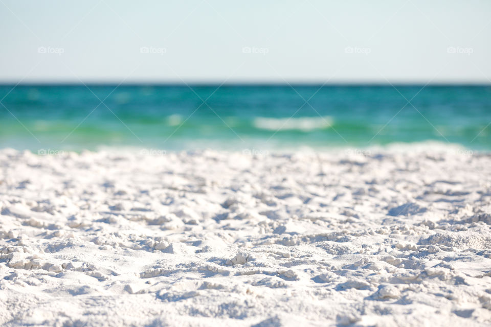 Sugar white sand beach on hot summer day in Florida with ocean at the background