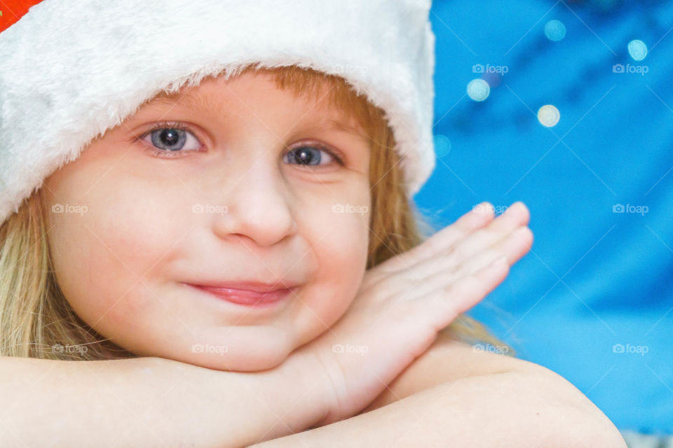 pretty little girl in Santa hat