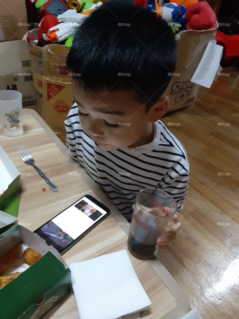 watching is favorate channel while drinking his favorate coca cola
