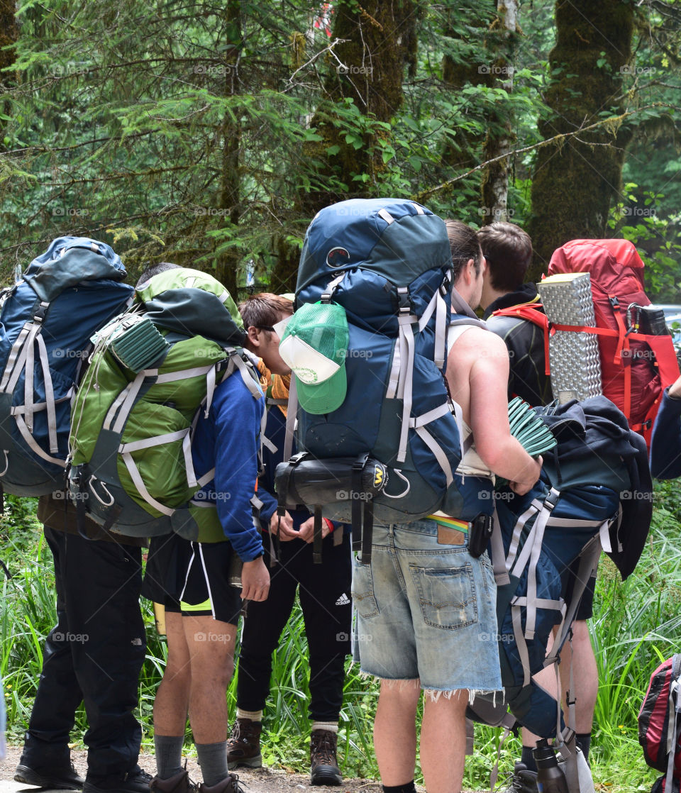 A group of young people ready for backpacking in the rainforest in Washington