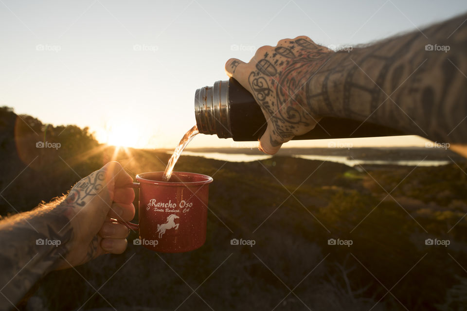 Pouring Tea During Sunset