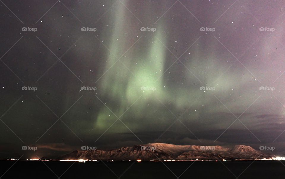 Aurora borealis in Iceland. amazing natural phenomenal. this is taken in the Reykjavik city which has strong light pollution yet the northern light still clearly visible