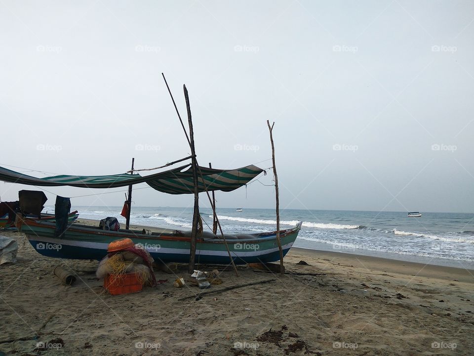 A boat docked at a beach