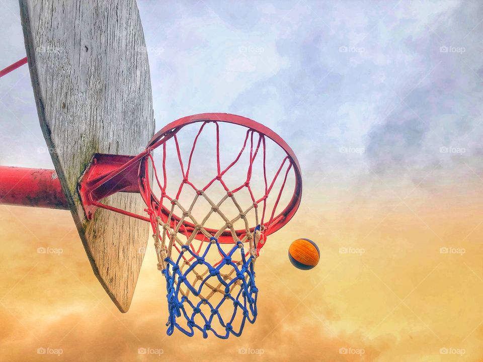 Basketball making the shot colourful sky 