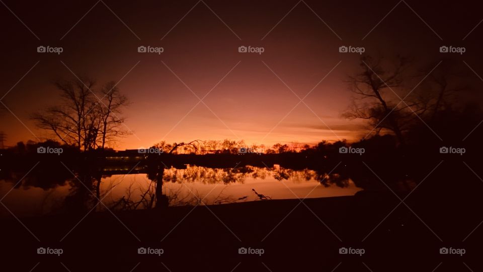 Silhouette of sky, silhouette of Night Captured During Silhouette of Reflections on Lake Waters. 