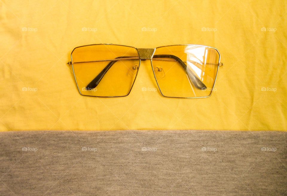 yellow sunglasses folded