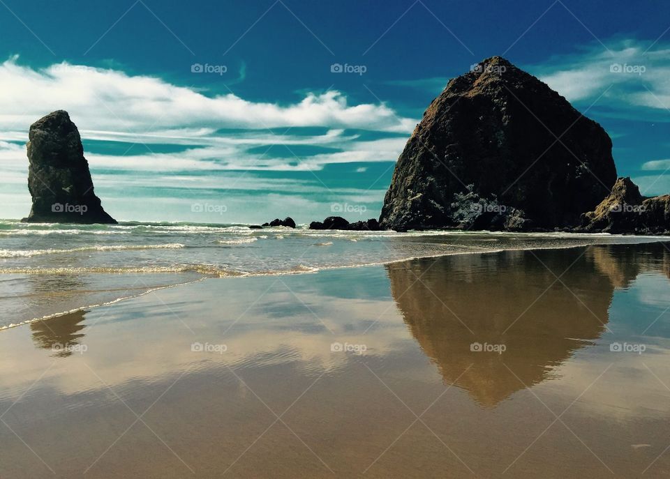 Rock reflection on beach