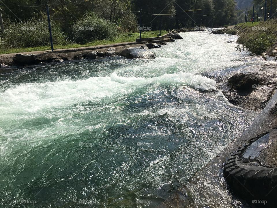 View of river flowing through rocks