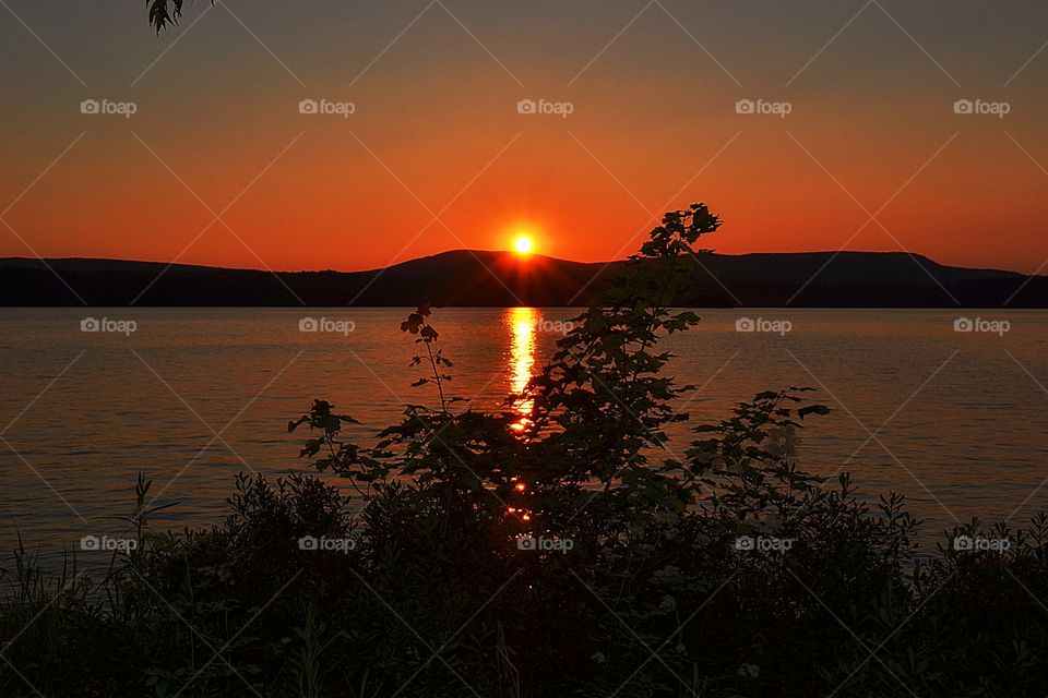 Sunset in the mountains. Glorious Adirondack mountain sunset, Chateaugay lake, northern New York State, July 2015