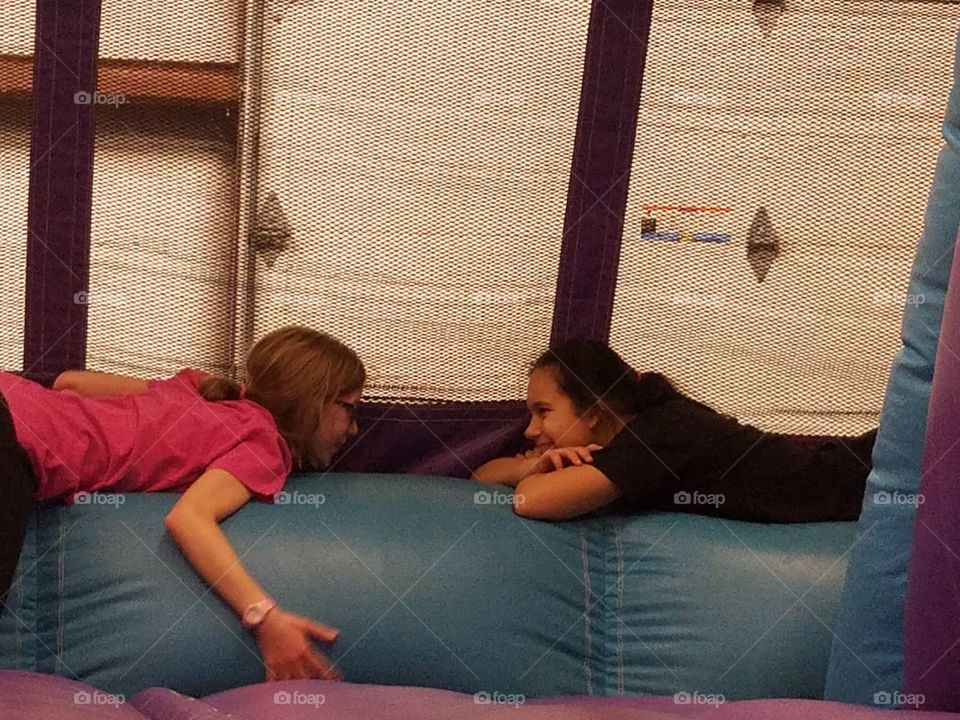 girls playing in a bouncy house