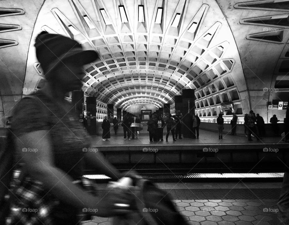 Woman passes in a subway station