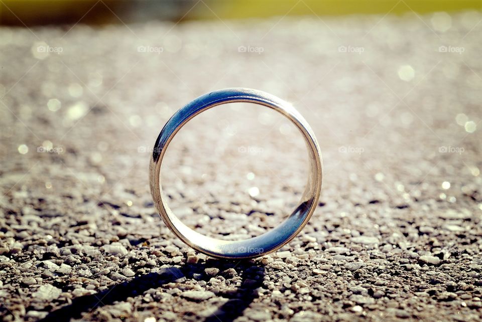 A wedding band stands in profile.