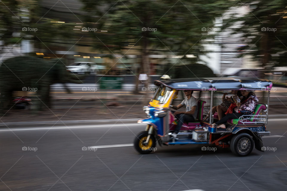 Tuk tuk taxi moving fast