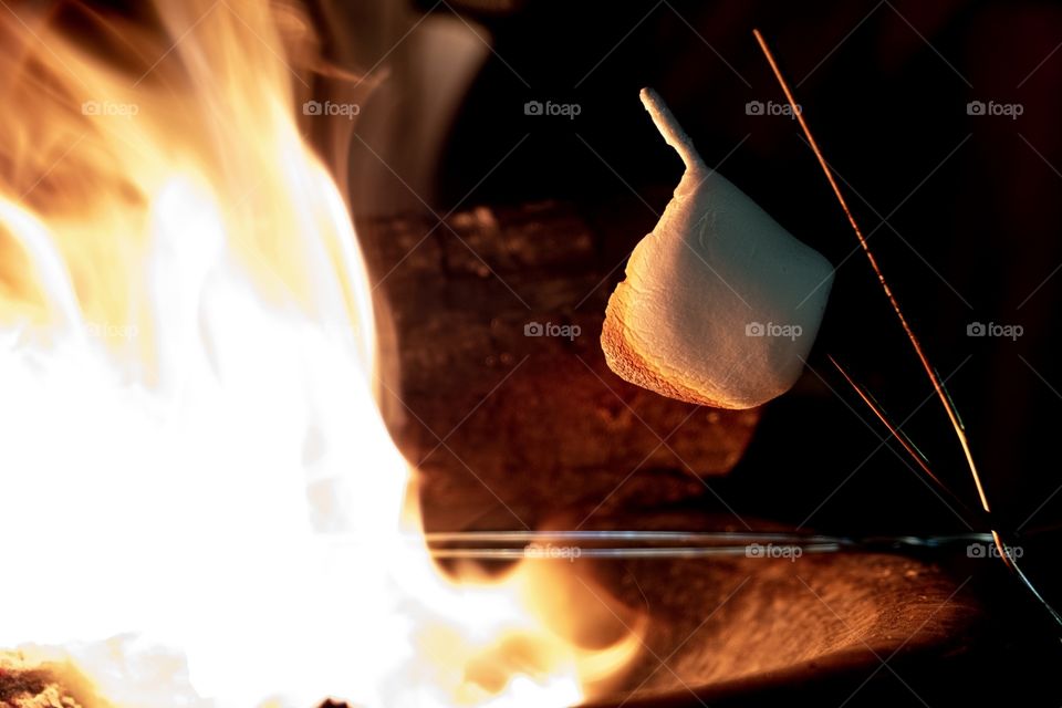 A roasting marshmallow sagging on the stick. Perfect consistency for s’mores! 