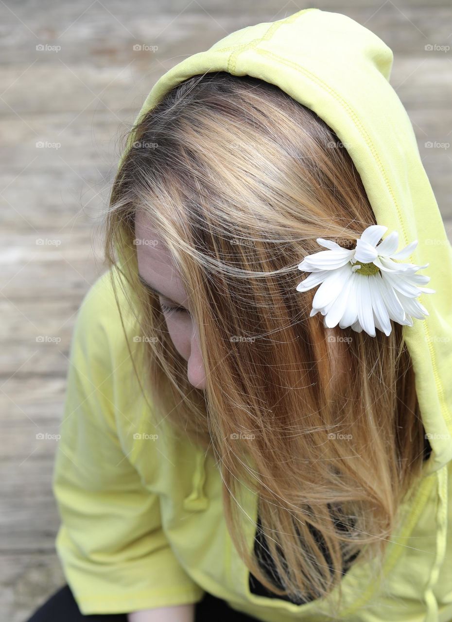 I’ll be your Daisy; Woman in yellow hoodie and white daisy in her hair