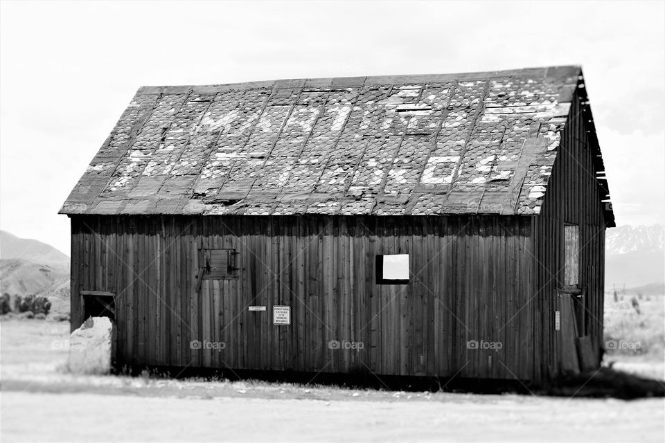 A roadside barn is worn from years of weather
