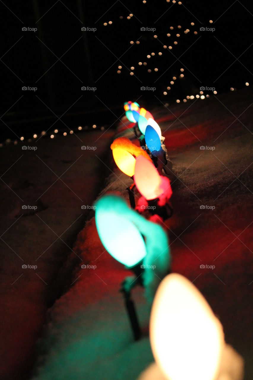 Christmas lights in the snow