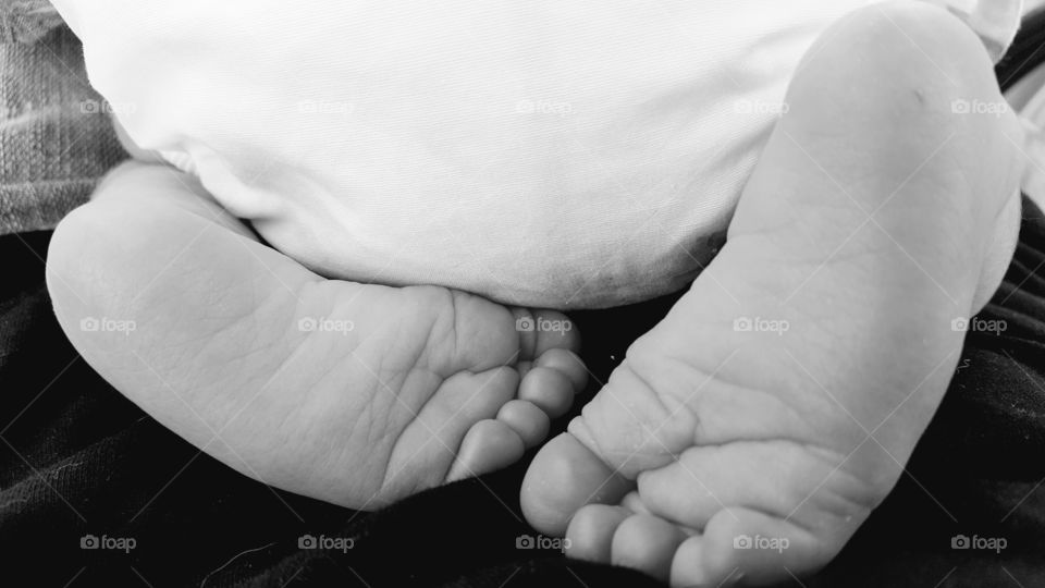 A close-up of baby tiny foot