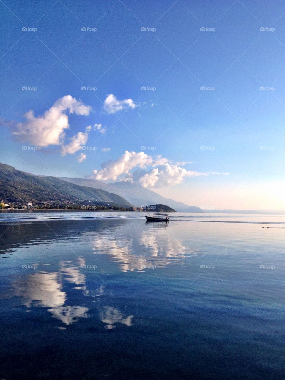 Sky and clouds reflection on sea