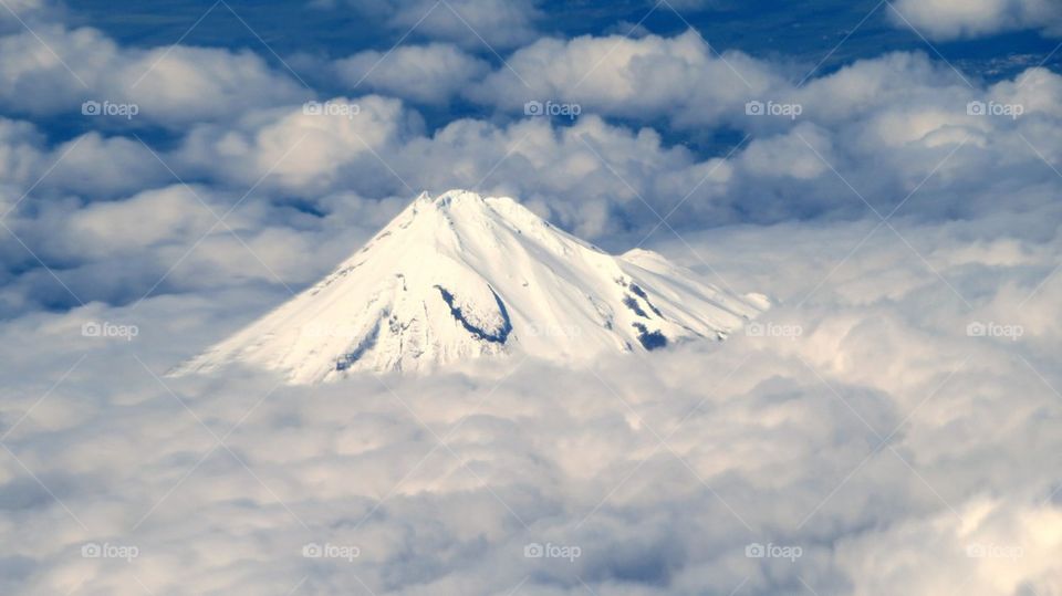 Mountain peak surrounded by clouds