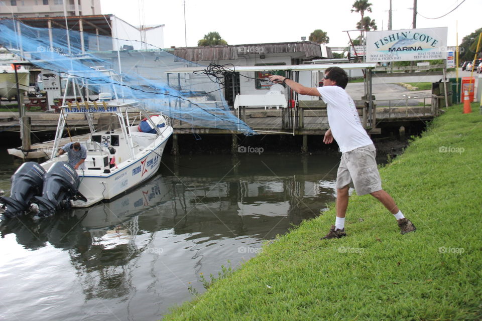 Fisherman with cast net