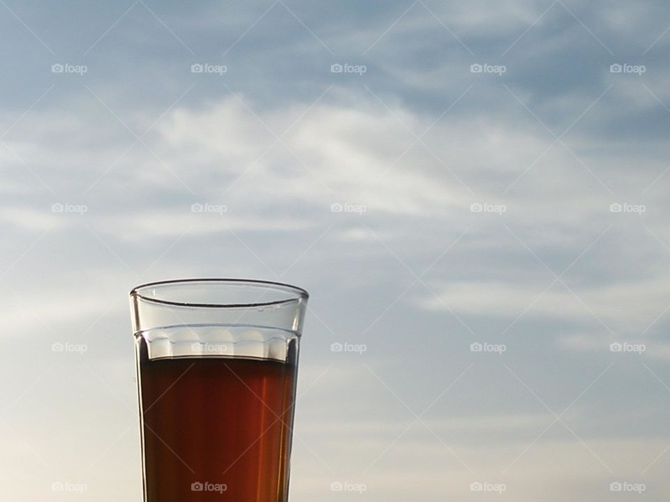 Beautiful cup of tea embraced foggy sky.