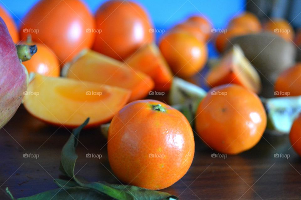 tropics fruits healthy food wood background