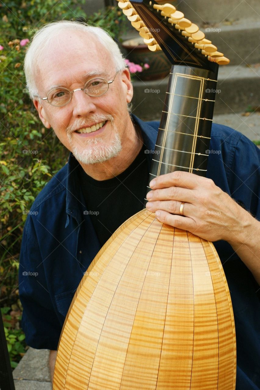 Man with lute. Senior music