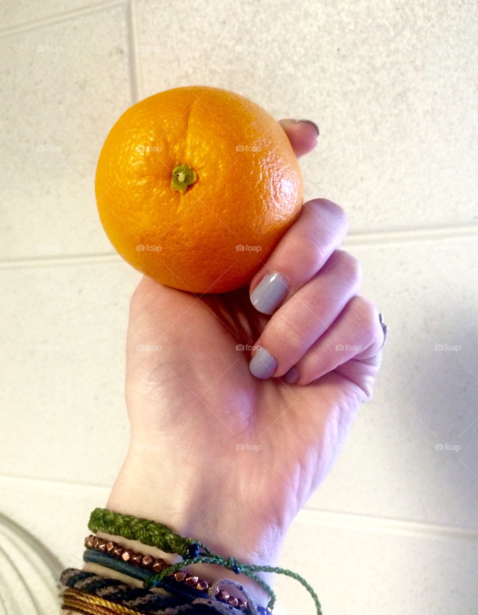 Hand and orange