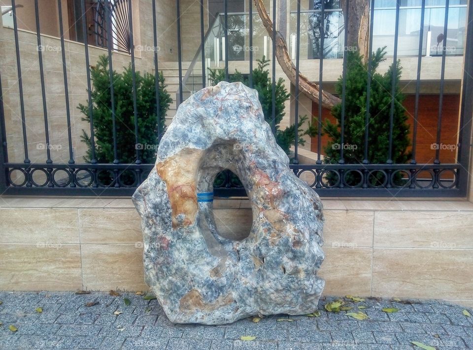 stone at the fence of the house камень у о