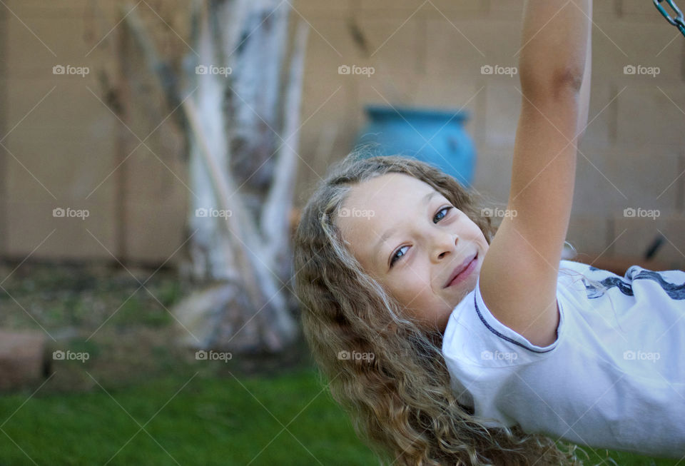 Girl on swing looking