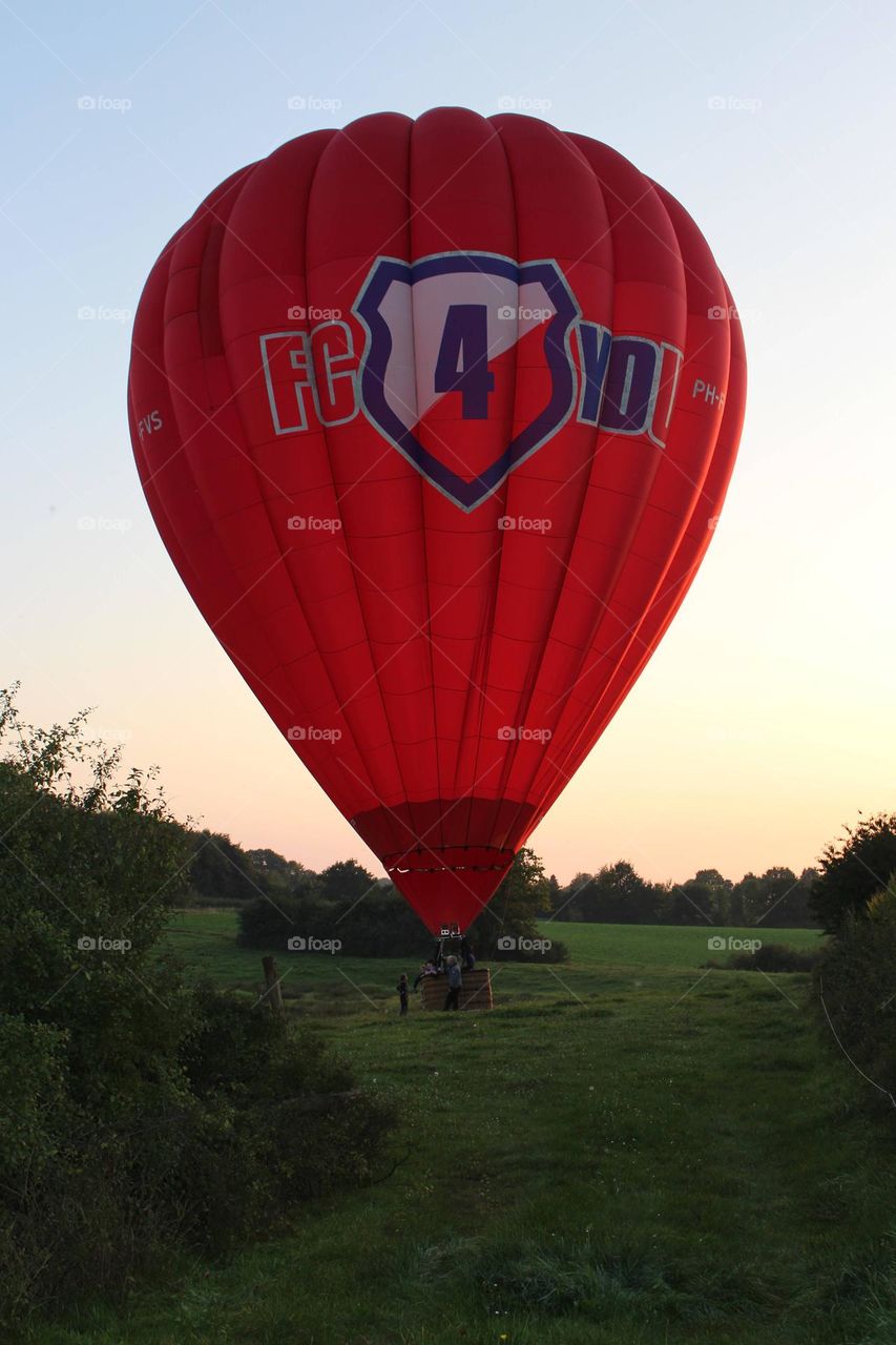 Hot air balloon on the ground. The air ballon is just land after is sail on the air