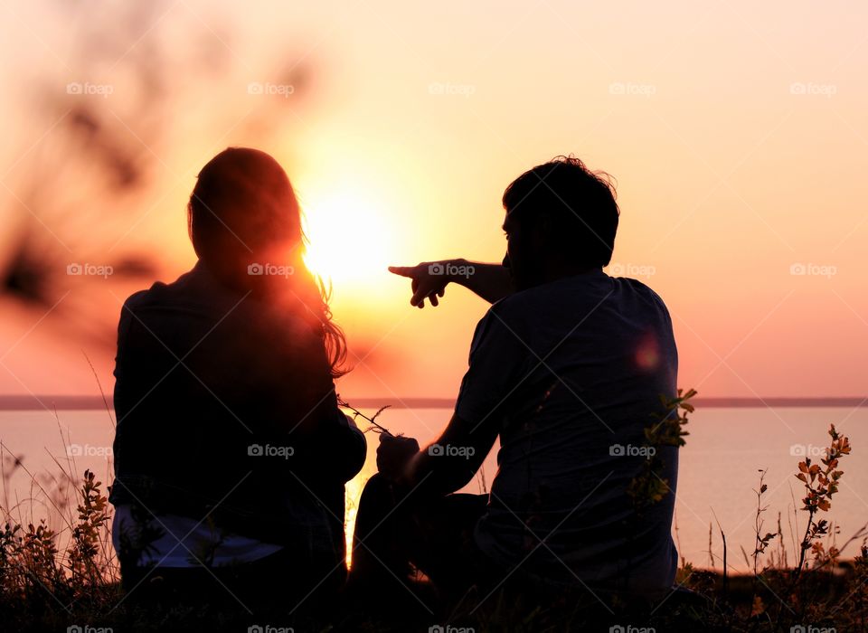 silhouette couple in love on the sunset