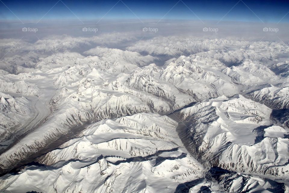 Aerial view of the snow capped mountains 