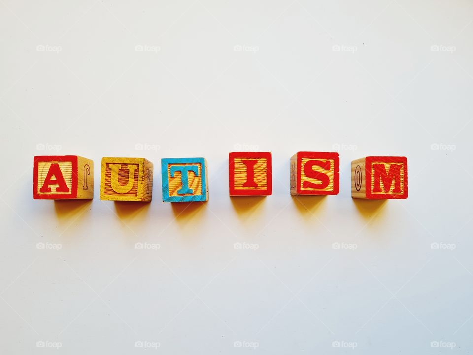 written autism on a white background