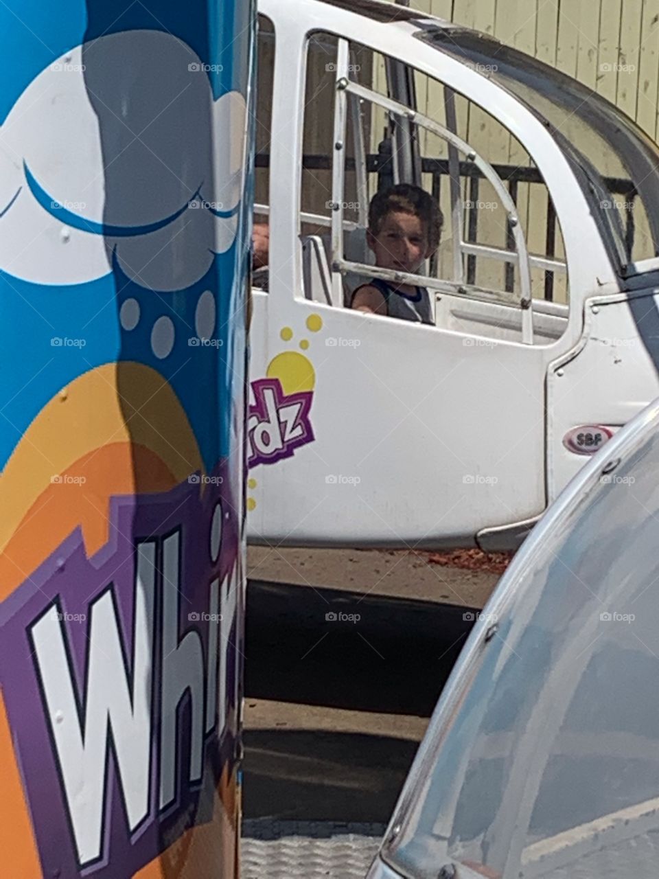 Kid on an amusement ride