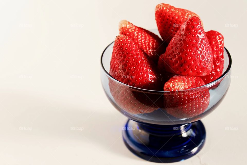 Red and juicy strawberries inside the pot