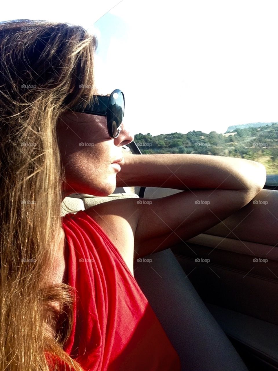 Enjoying the last summer days while driving a cabriolet 