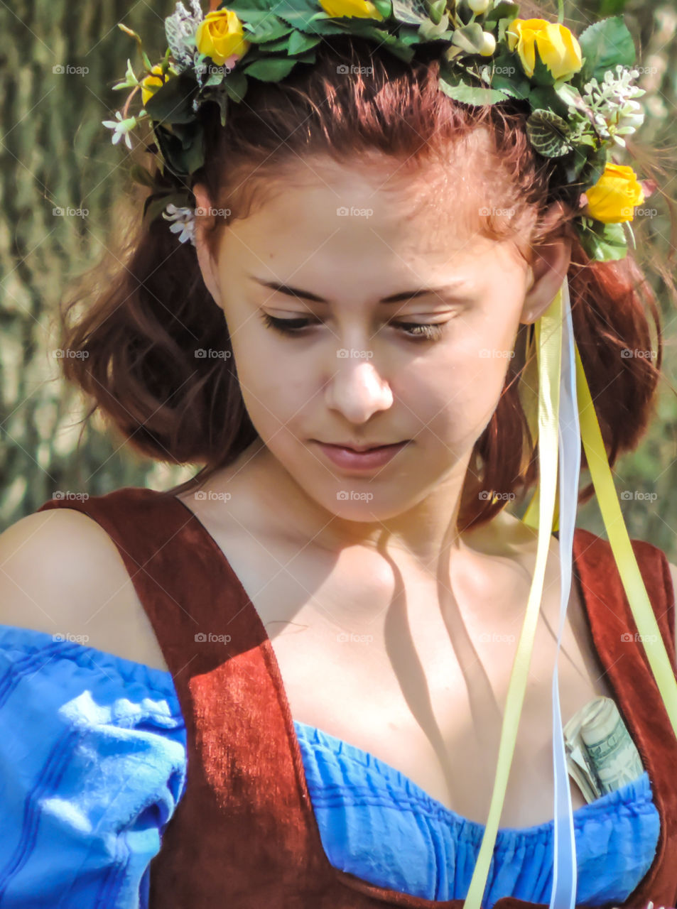 Portrait of beautiful girl with wreath