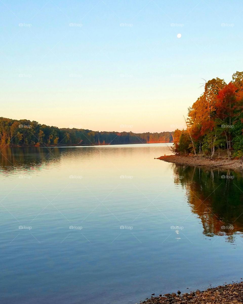 Moonlight during early morning rejected on lake