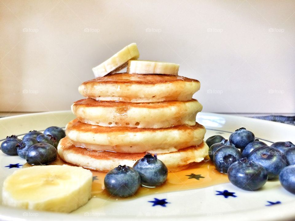 Pancakes with blueberries and syrup