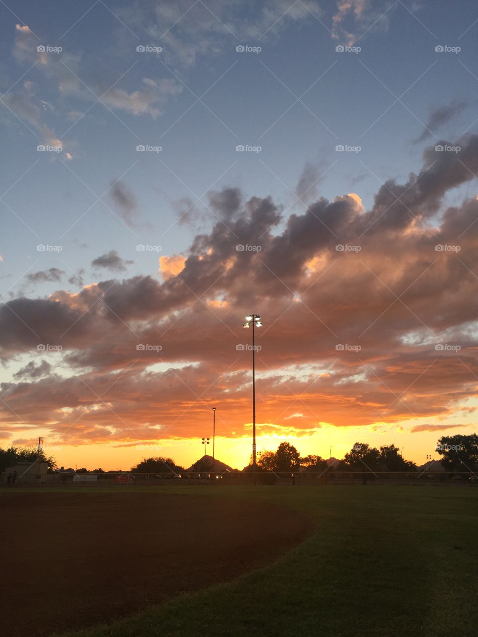 Sunset over baseball field 